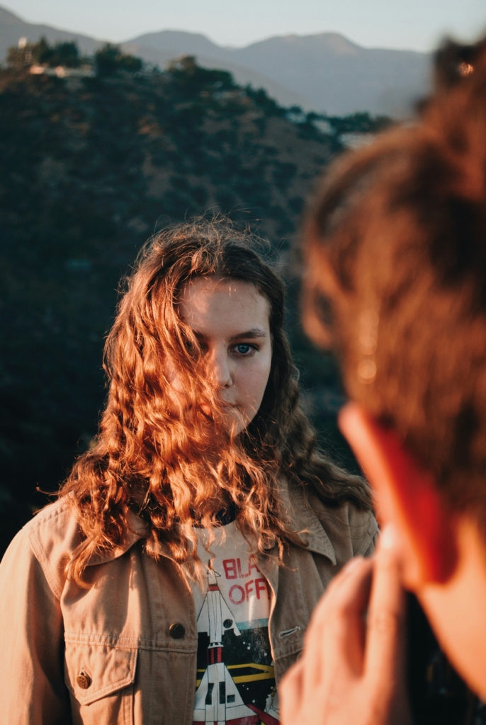 Girl with hair covering her face, portrait